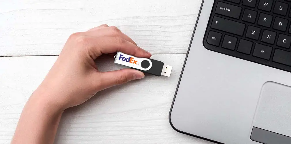 USB Stick next to laptop