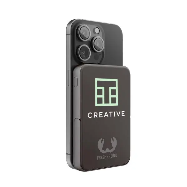 Fresh 'n Rebel Magnetic Wireless Powerbank   Compatible with MagSafe iPhones (iPhone 12 and up) Built-in iPhone stand Airline approved Available in multiple colours  Personalise with a print in full colour and sleeve