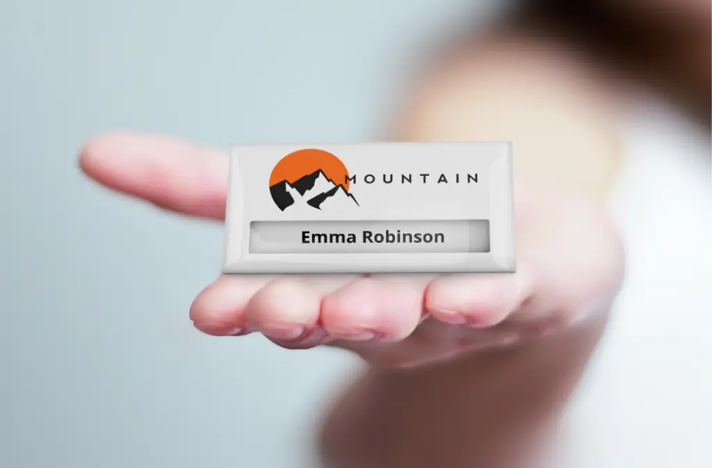 Metal badge in a hand