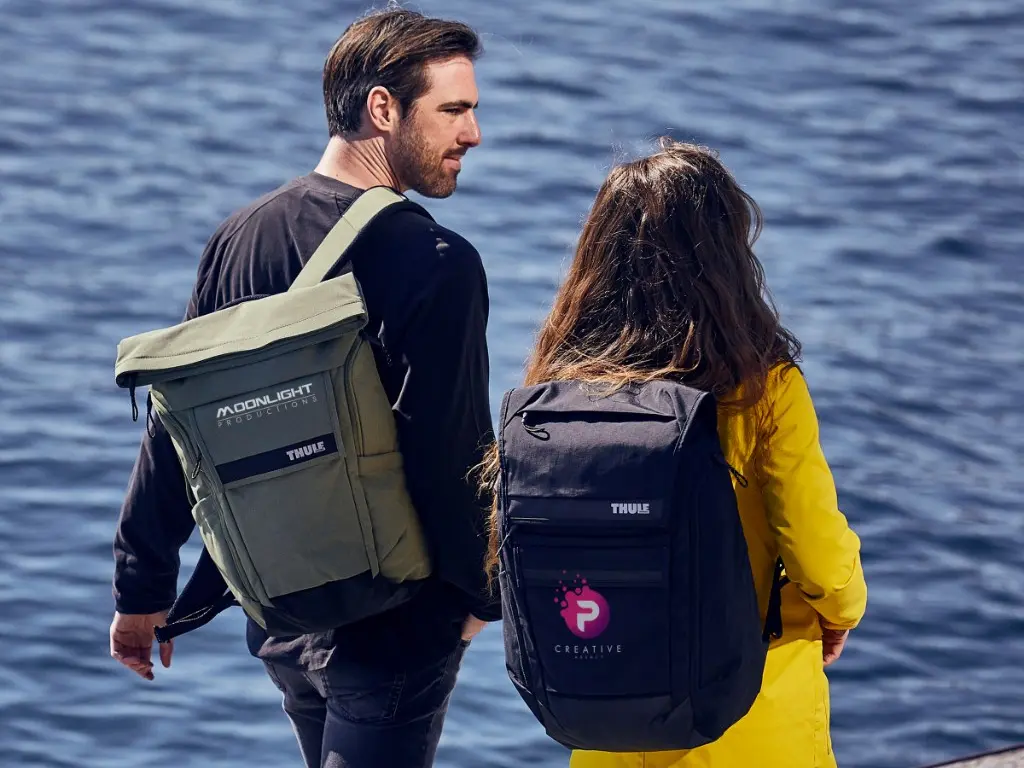 people with thule bags at river